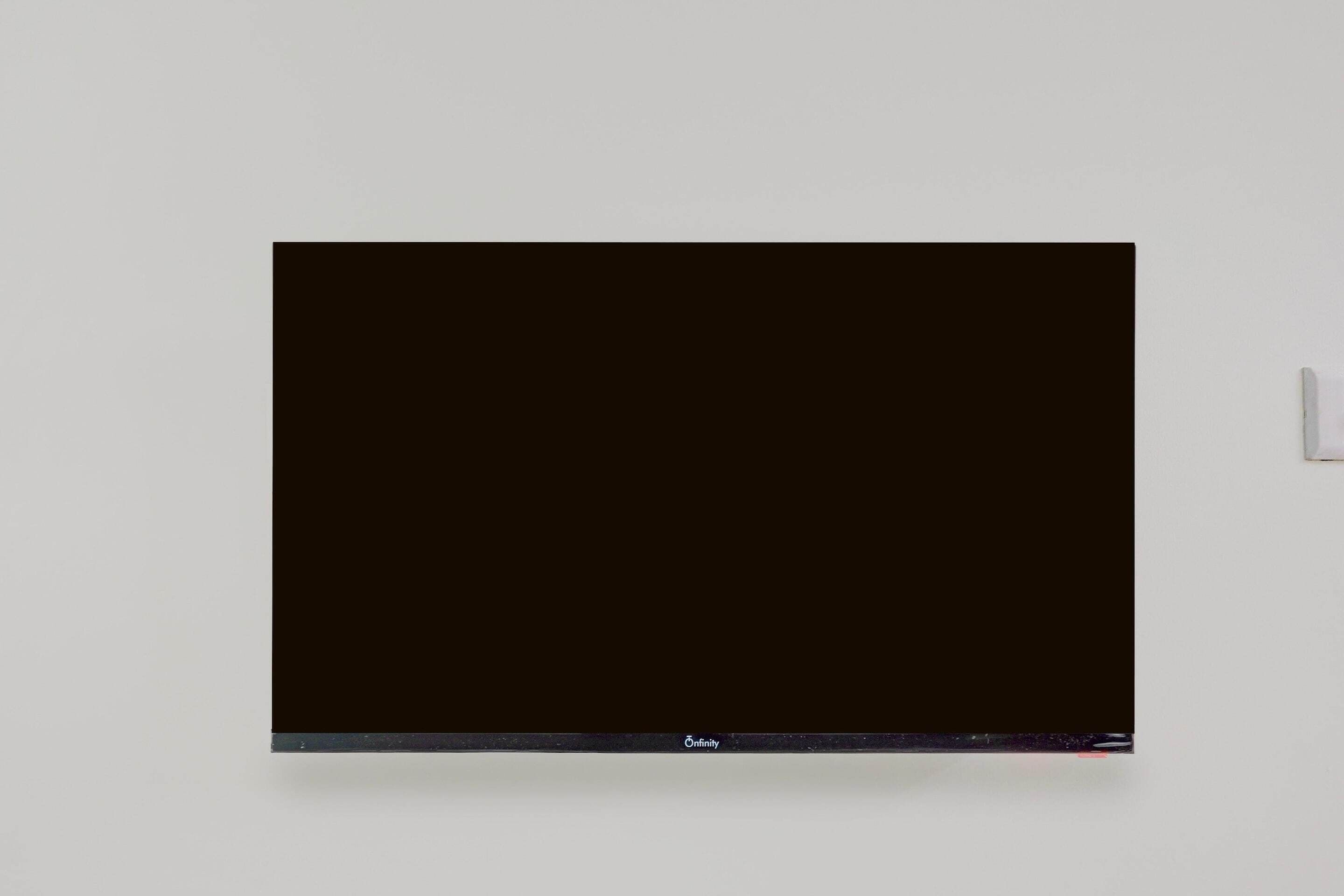 A black screen on a wall.