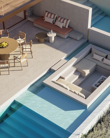 A modern outdoor pool area with a seating area, a dining table, and chairs.