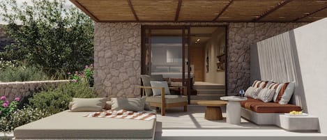 A modern outdoor living area with a pool, stone walls, and a wooden pergola.
