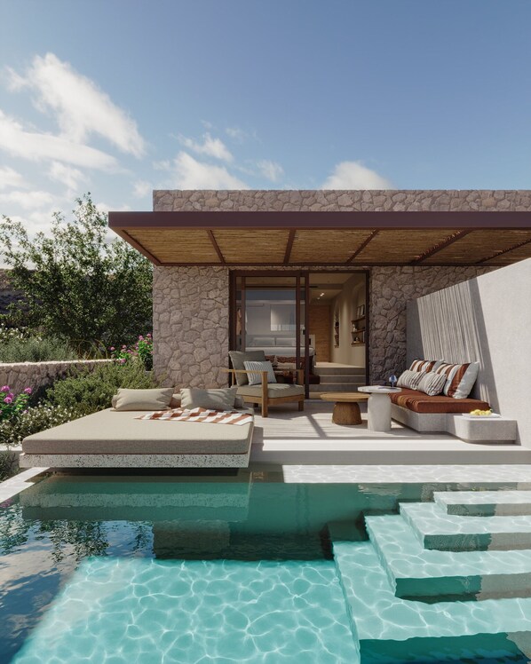 A modern outdoor living area with a pool, stone walls, and a wooden pergola.