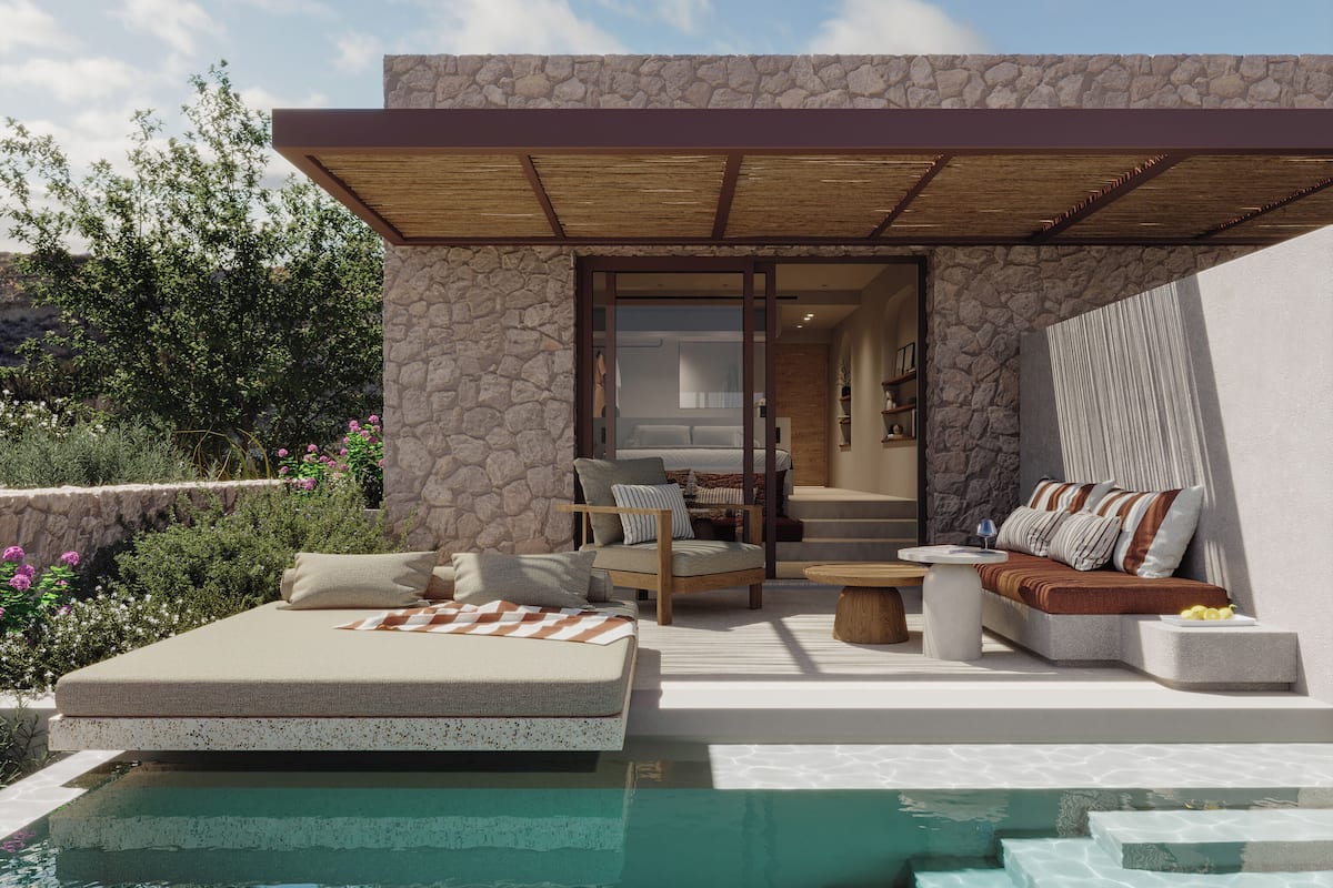 A modern outdoor living area with a pool, stone walls, and a covered seating area.