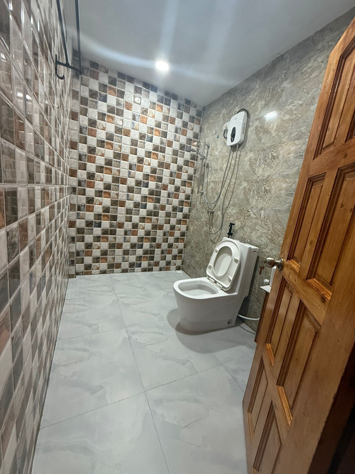 Shower, hair dryer, towels, toilet paper