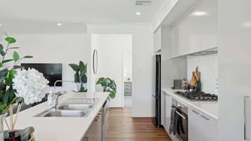 Coffee/tea maker, fridge, microwave, oven