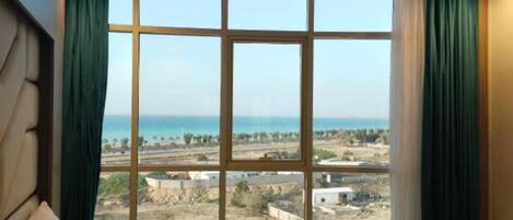 Basic Apartment, Partial Sea View | In-room safe, blackout curtains, iron/ironing board, free WiFi