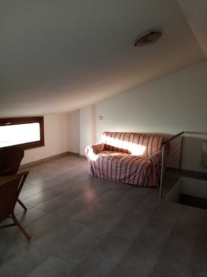 Living area - Attic room near the beach (Alghero)