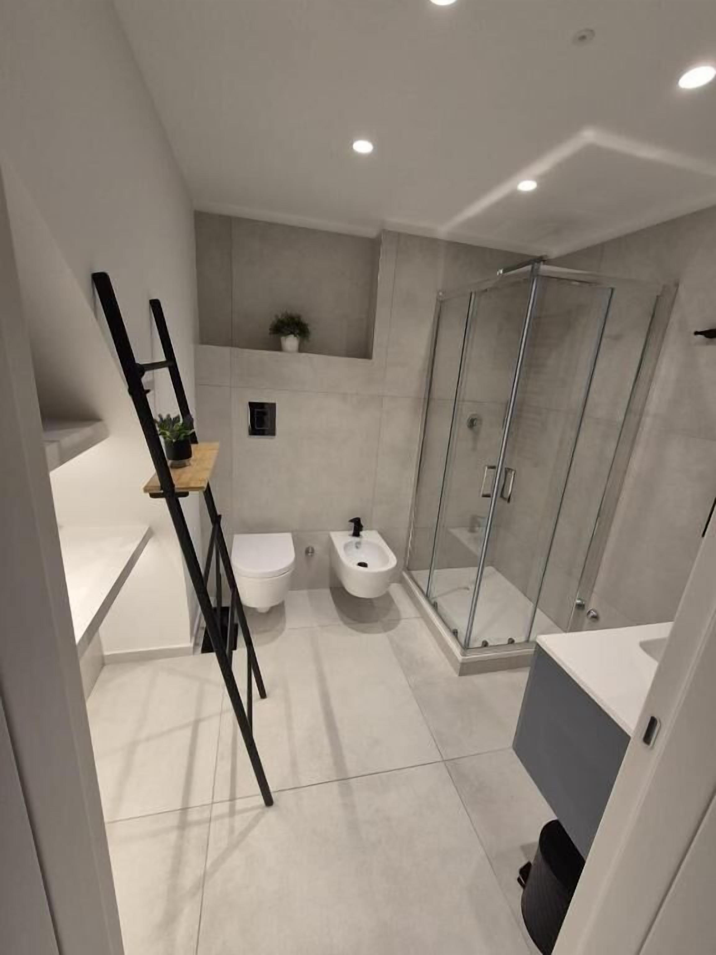 Camera quadrupla | Bagno | Pantofole