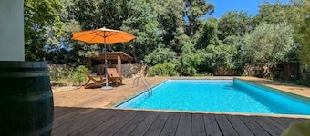 Charming stone house in a quiet setting with a pool and a garden with trees