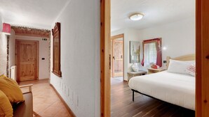 A bedroom with a bed, a wooden bench, a small table, and a mirror. - Room 'Camera 5 - Doppia' with Mountain View and Wi-Fi (Mont-Rion)