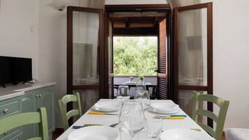 Apartment, 1 Bedroom | Living area | 30-inch TV with satellite channels