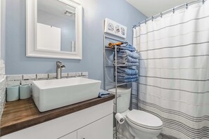 Shower, hair dryer, towels, shampoo