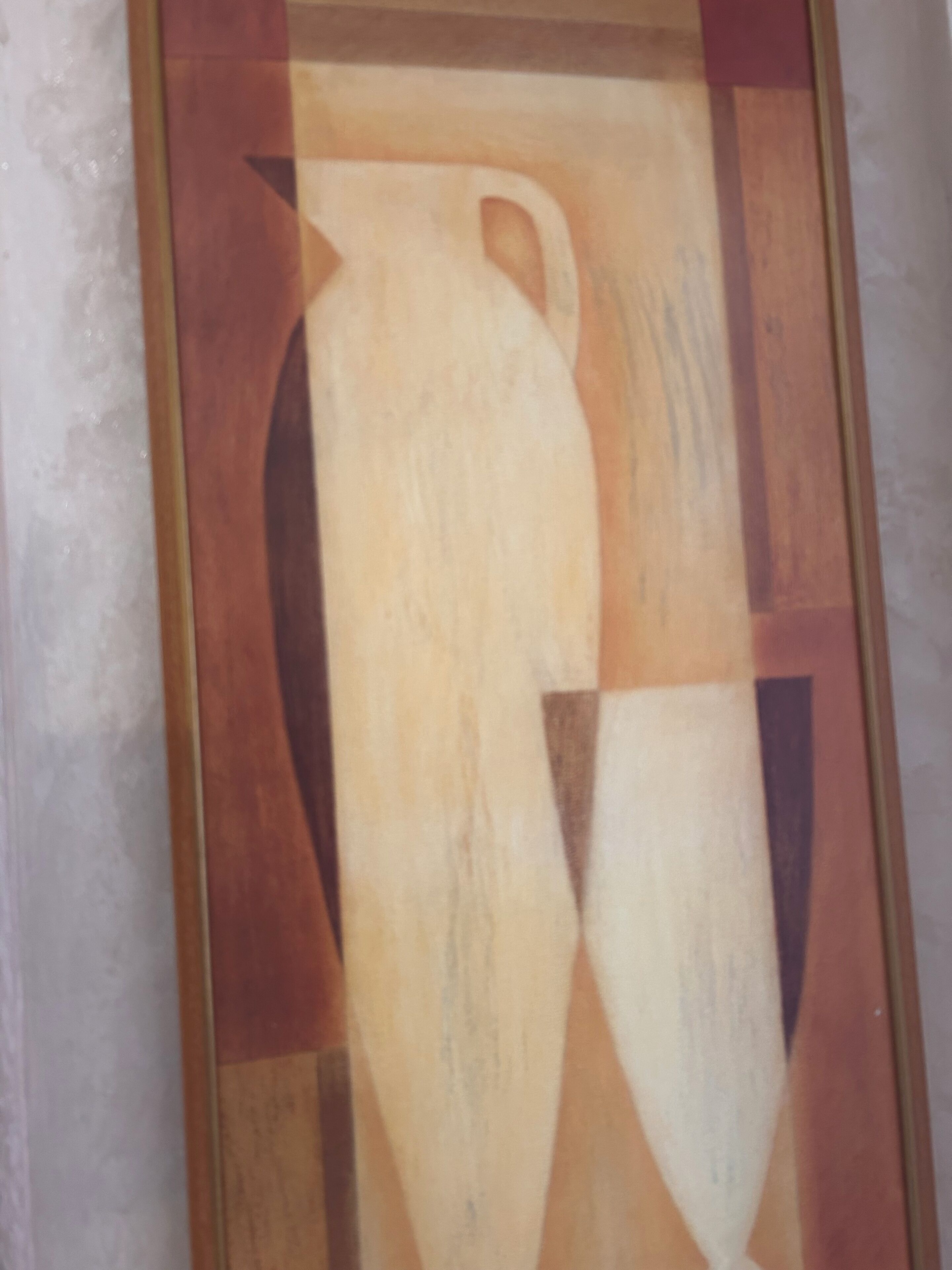 A framed abstract painting with geometric shapes and a vase.