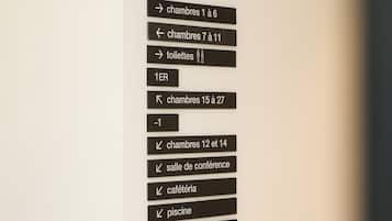A hotel directory with room numbers and amenities.