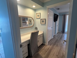 A bathroom with a vanity, mirror, and a towel rack. - Golf Views, Beach Service & Pets Welcome (Destin)
