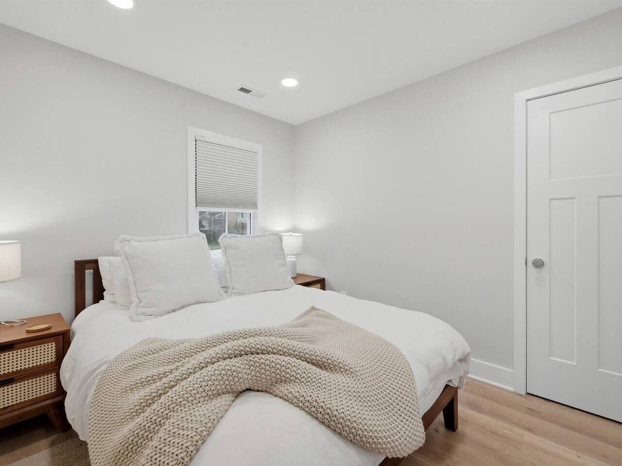 Open living room with Smart TV flowing into the kitchen