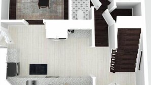 Ein Grundriss einer modernen Wohnung mit Wohnbereich, Essplatz, Küche und einer Treppe.