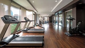 A gym with treadmills, exercise bikes, and weight machines. - Quiet-NearTerminal21 Malls/BTSNana/SkylineView/Gym (Khlong Toei)