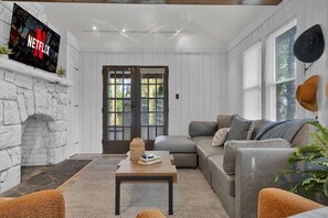 TV, fireplace, books