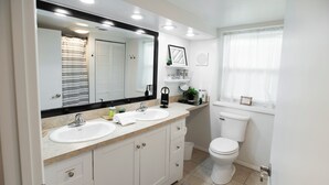 A modern bathroom with two sinks, a large mirror, and a toilet. - 2 Connected Private Suites| 0.4mi OWU |Free Parking|Quiet Street|Patio|W/D (Delaware)