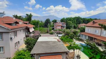 Family Room, Balcony, City View | Pool