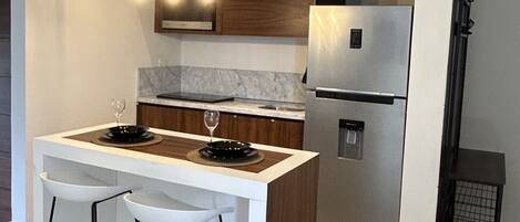 Fridge, microwave, stovetop, coffee/tea maker