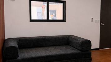 Comfort-huoneisto, 2 keskisuurta parisänkyä, patio | Oleskelualue