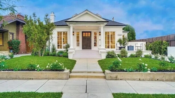 A two-story house with a front porch, a driveway, and a well-maintained lawn. - Stunning Indoor/Outdoor Space w/H Hills View, Pool - Casa Bonita LA (Los Angeles)