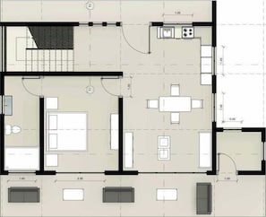 A floor plan of a hotel room with a bed, a desk, a chair, a small table, a sofa, and a bathroom.