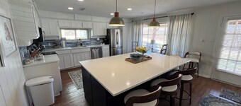 This cozy home has lake access and fishing pier.