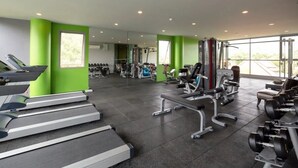 A modern gym with treadmills, weight machines, and dumbbells. - 2BR Comfort Pool Access Bangtao & Nightlife C178 (Chang Wat)