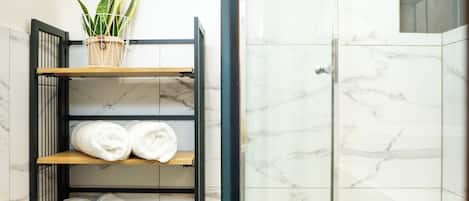 Shower, hair dryer, towels, toilet paper