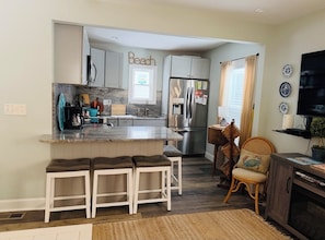 Coffee/tea maker, fridge, microwave, oven