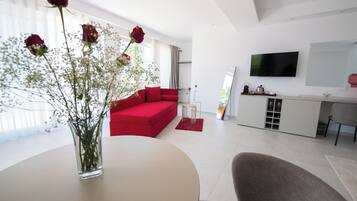 Quadrupla Deluxe, balcone, vista mare | Area soggiorno