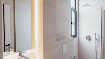 Deluxe Apartment, 1 Bedroom | Bathroom | Shower, hair dryer, slippers, towels