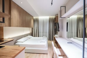 Suite estudio Deluxe | Tabla de planchar con plancha, wifi gratis y ropa de cama 