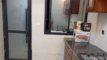 Deluxe Penthouse, Kitchen, City View | Private kitchen