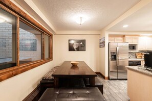 A compact kitchen with a built-in refrigerator, microwave, and coffee maker. - Park City townhome with 2 bedrooms, den, and 3 baths. (Park City)