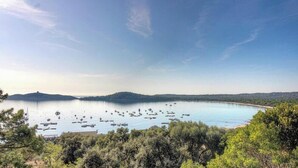 A coastal landscape with a bay, boats, and dense greenery. - Bella vista 4 - SAINTE LUCIE DE PORTO VECCHIO (SAINTE LUCIE DE PORTO VECCHIO)