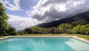 A swimming pool with a view of mountains and trees. - The San Michele - SISCO (SISCO)