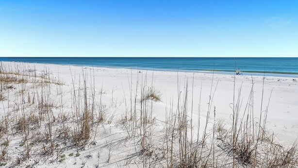 A beach with sand dunes and sparse vegetation. - Anchors Up | Private Pool | Kayaks | Outdoor Games | My Beach Getawys (Pensacola)