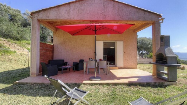 A covered outdoor patio with seating, a grill, and a view of the landscape. - Cerise - FIGARI - Gîte (FIGARI)