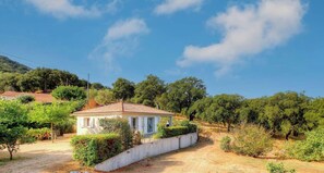 A small house with a tiled roof, surrounded by greenery and trees. - The Orange Tree - SOLLACARO (SOLLACARO)
