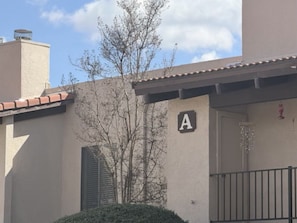 A building with a 'A' sign, a door, and a window with shutters. - Sedona 3/2 Condo Pool - Hot Tubs - Tennis-Pickleball (Sedona)