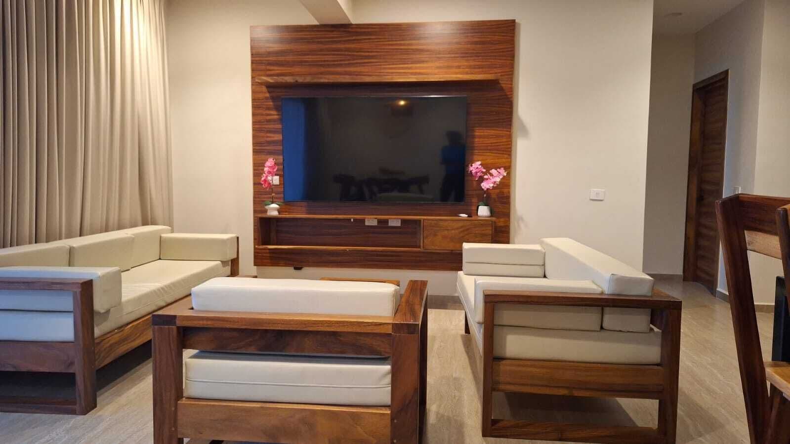 Suite Deluxe, balcón, vista al mar | Área de sala de estar