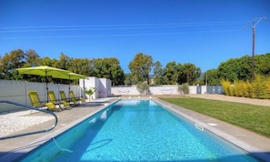 A swimming pool with a clear blue water, surrounded by a grassy area and trees. - Chez Dumè 2B59 - CASTELLARE DI CASINCA (CASTELLARE DI CASINCA)