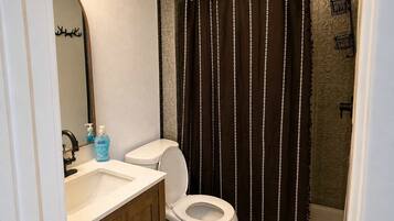 Shower, hair dryer, towels, shampoo