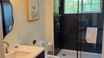 Shower, hair dryer, towels, soap