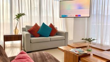 Family Apartment | Living area | 60-inch LED TV with cable channels