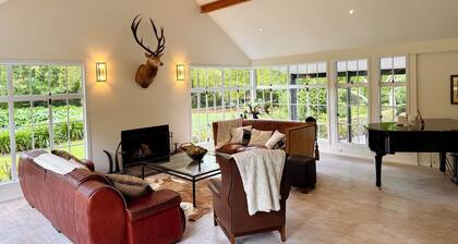 English country estate lodge, in secluded parklike grounds.