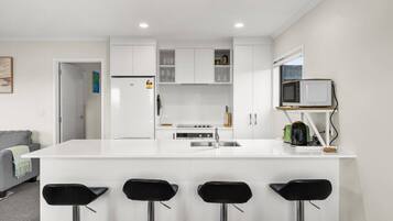 Coffee/tea maker, fridge, microwave, oven