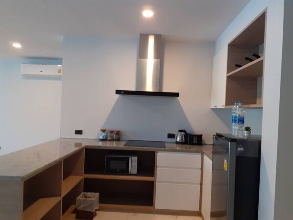 A modern kitchen with a microwave, a built-in oven, a dishwasher, and a water dispenser. - 2 Bedroom Unique Indoor Pool Villa (Bophut)
